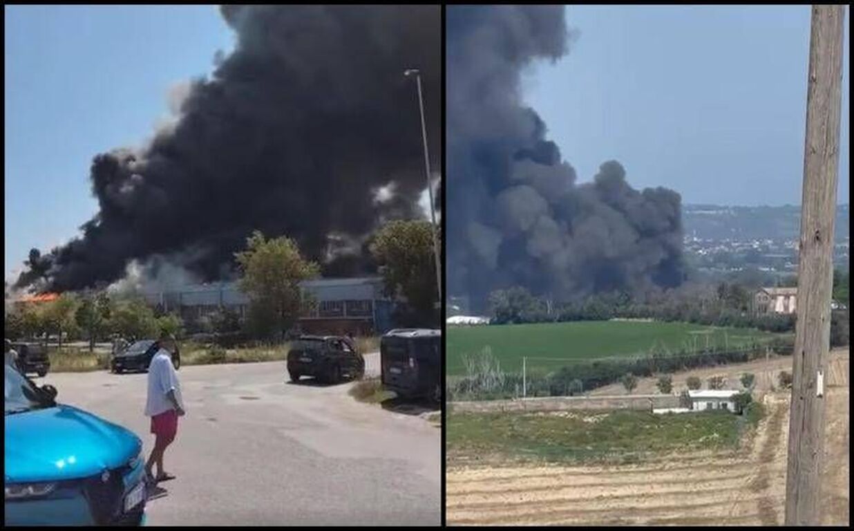 Fano, incendio nella zona industriale. Enorme nube di fumo nero