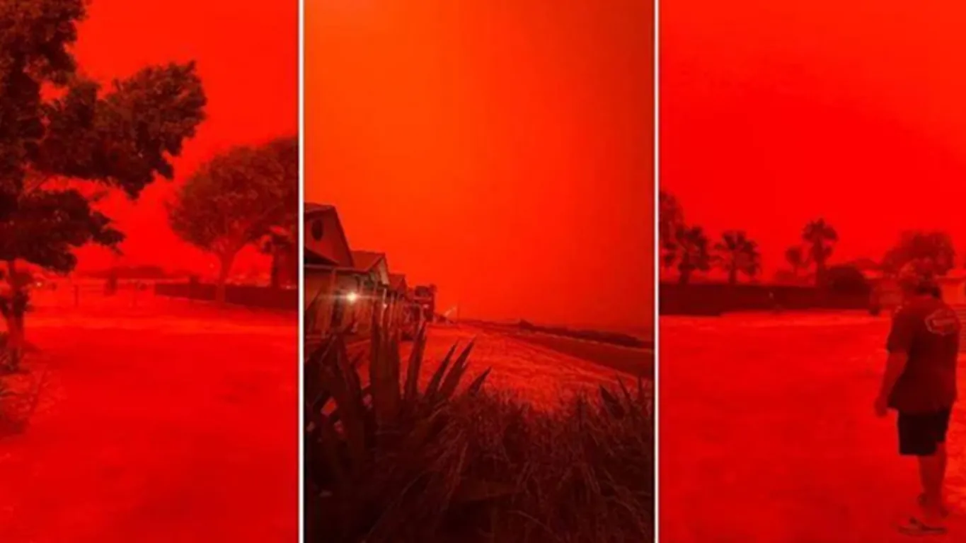 Cielo apocalittico in Australia, il ciclone Narelle tinge tutto rosso sangue: le immagini sono virali